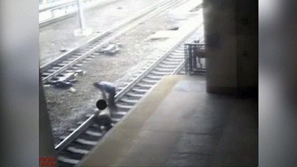 Hero cop pulls man off tracks seconds before train arrives