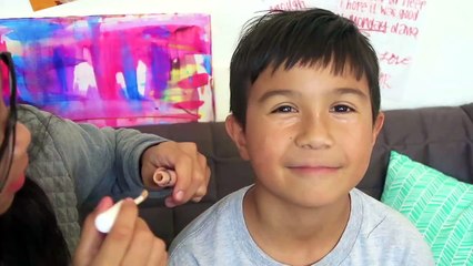 Doing my little brothers makeup!