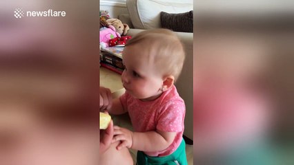 Adorable baby tries lemon for the first time