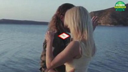 Pamela Anderson looks RAUNCHY in a French music video Flaunting Her ample CLEAVAGE