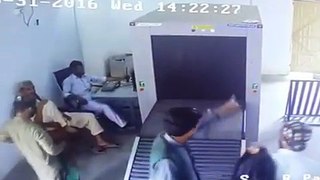 Security Check - Man Goes Through Scanner
