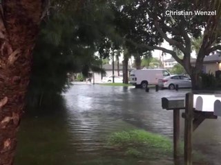 Man paddleboards through streets of Indian Rocks Beach