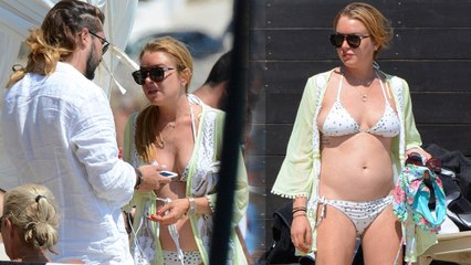 Lindsay Lohan Flaunts Her Trim Figure with Male Pal