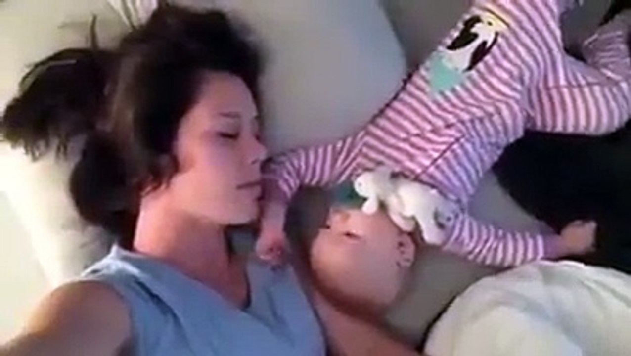 Baby playing with mom