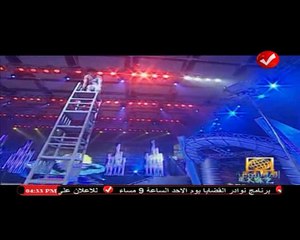 #الموسوعة | الشخص الذي قام بإرتداء 12 تيشرت مياة على جسدة في أقل من دقيقة