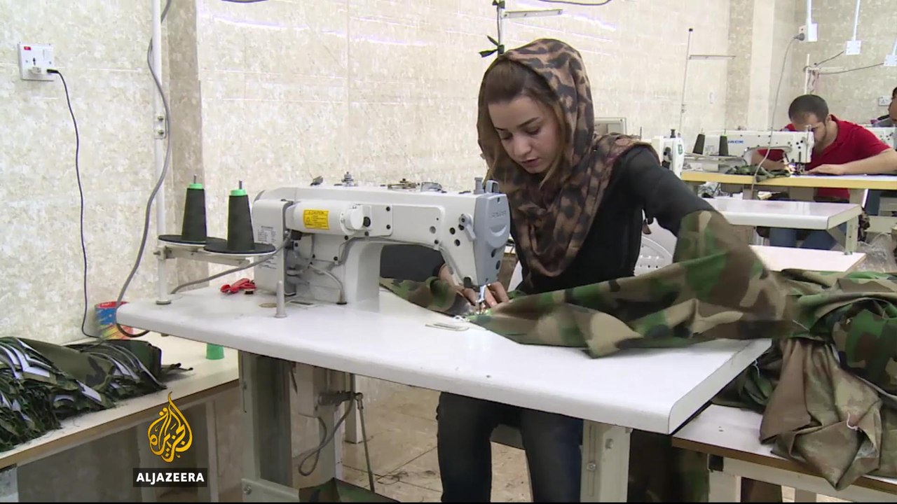 Iraqi woman solving uniform shortage for Kurdish fighters