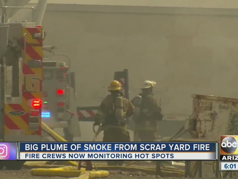 Scrap yard pile of tires, metal goes up in flames