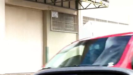 Man Carry A Fridge On His Shoulder While Riding A Bike