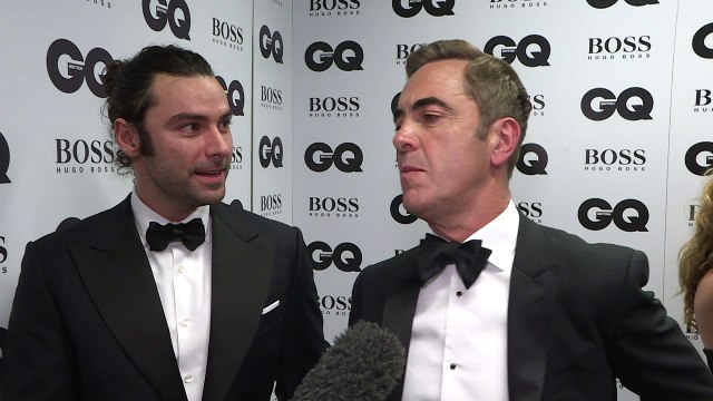 Aidan Turner laughs with James Nesbitt at GQ awards