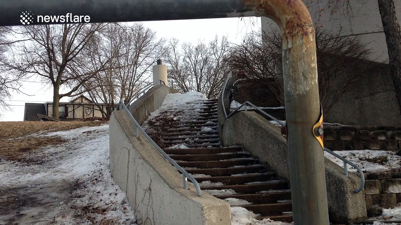 Man attempts to grind handrail on skis, hurts h...
