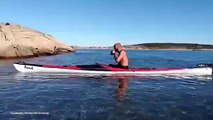 Priorities! Kayaker rolls his kayak without spilling his beer