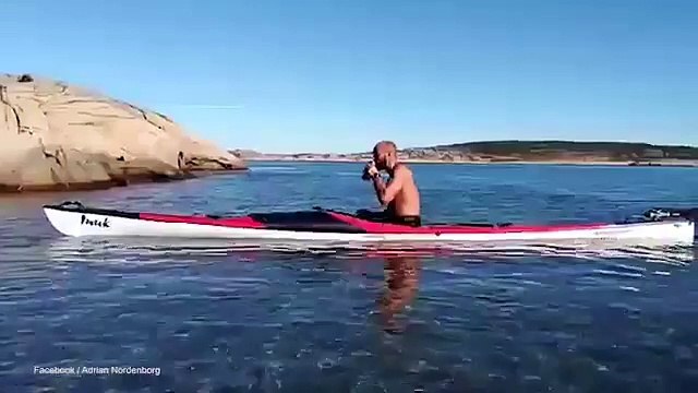 Priorities! Kayaker rolls his kayak without spilling his beer