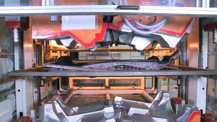 Automatic thermoforming line of automotive carpets