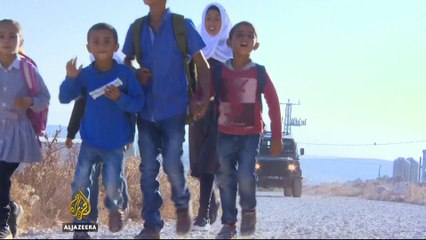 Israeli army escorts Palestinian children to school