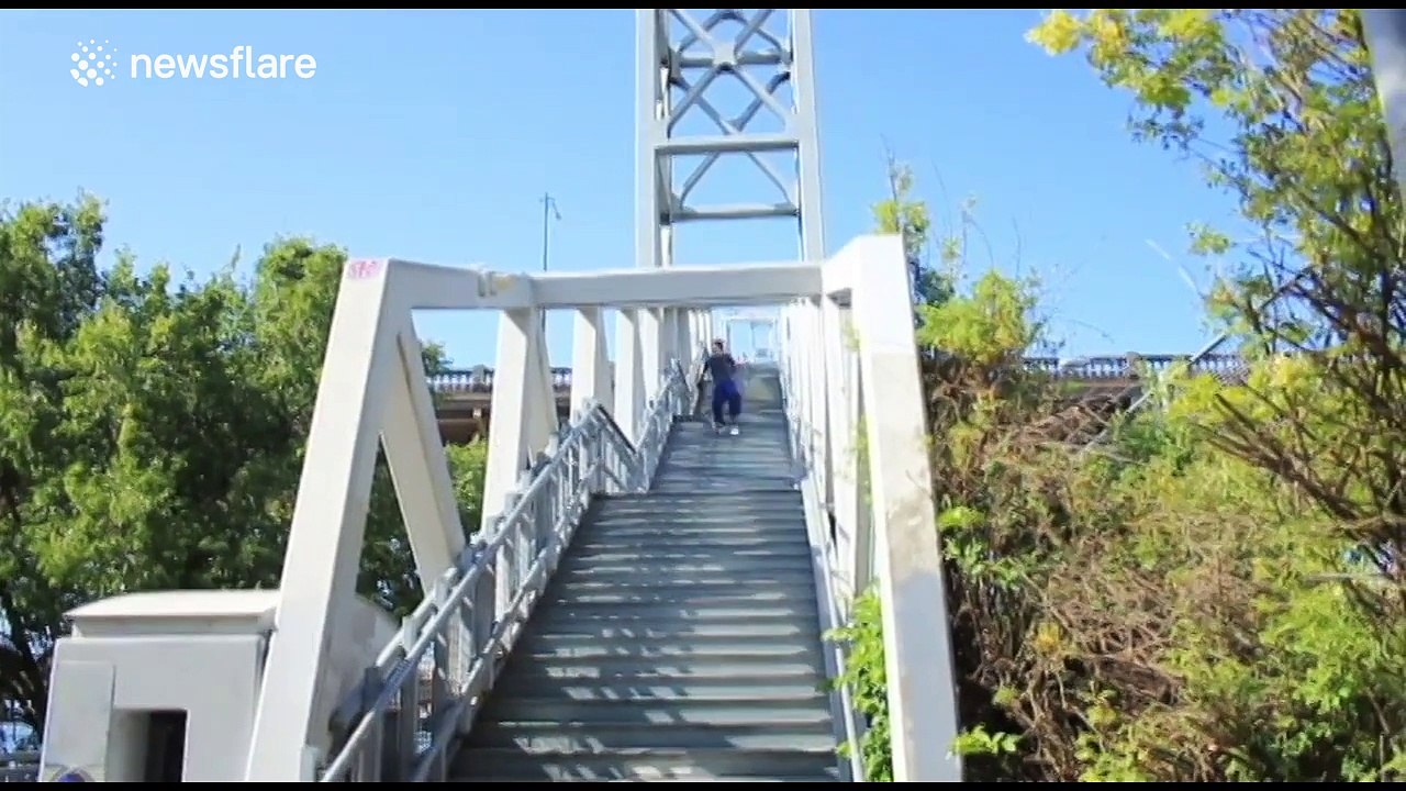 Man skis down stairs in downtown Portland