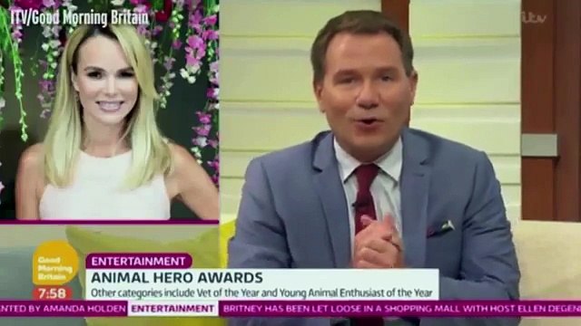 Amanda Holden falls to the floor as large playful dog jumps on her at Animal Hero Awards