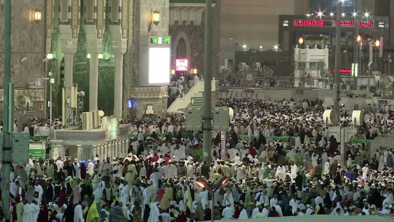 Muslims gather around the Kaaba shrine during t...