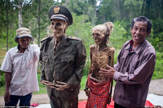 Indonesian villagers dig up their ancestors every three years and dress them in new clothes
