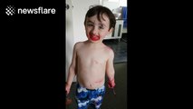 'Cheeky' toddler blames sister for covering him in lipstick