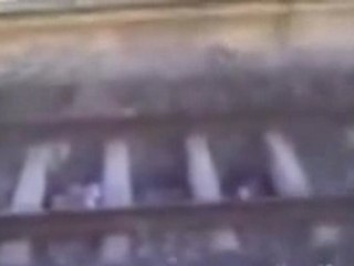 Crazy Kid hides under Train tracks