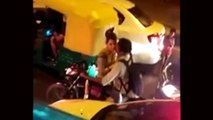 Indian Young Couple Kissing on Bike