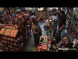 Armed robber meets his match CCTV every shopkeeper should be like this.