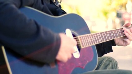 Street Artist Singing and Playing Guitar