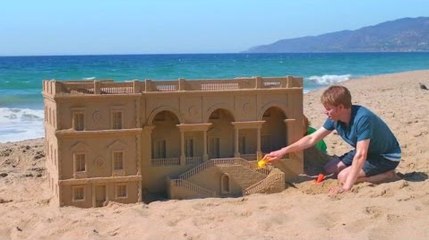 Dads compete to see who can build the biggest sandcastle