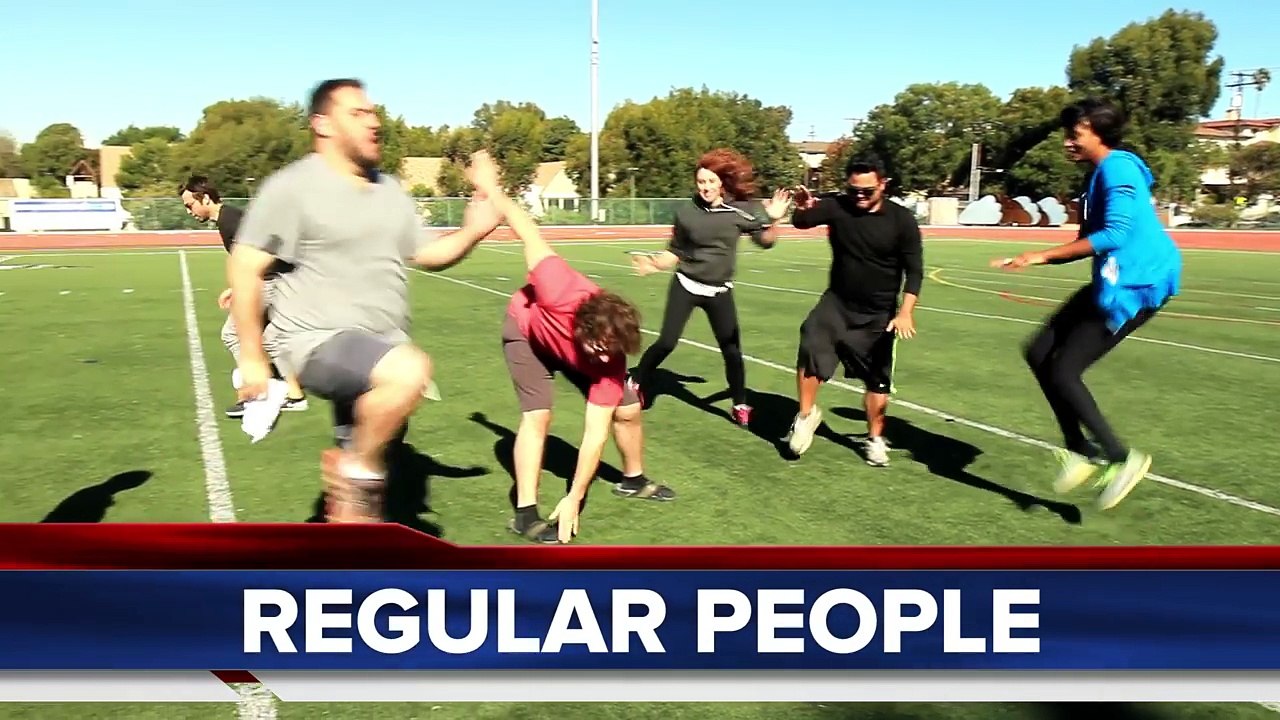 People Try To Catch Passes From An NFL Quarterback