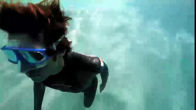 Guillaume Nery base jumping at Dean's Blue Hole, filmed on breath hold by Julie Gautier
