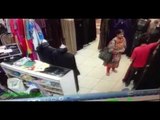 A Little Kid Caught In CCTV Camera Stealing Cash From a Shop With Help Of His Mother.