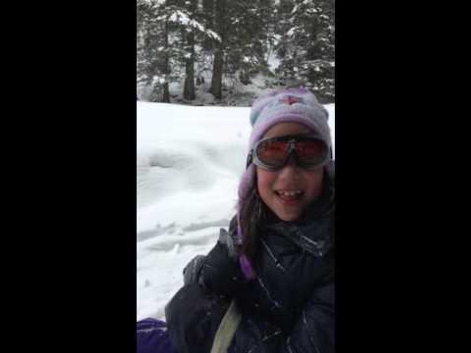 Dad and Daughters Enjoy Snowy Sledding in Switzerland