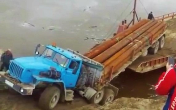Fail Truck Driver Backs Onto a Barge and Disappears Into Oblivion