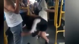 Funny video, Woman slips and grabs hold of a man's shorts as they travel on the bus