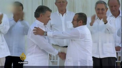 Colombia and FARC sign historic deal ending decades of war
