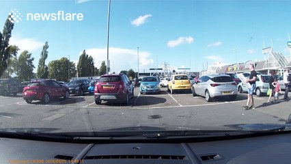 Oblivious driver takes up two spaces in parking fail