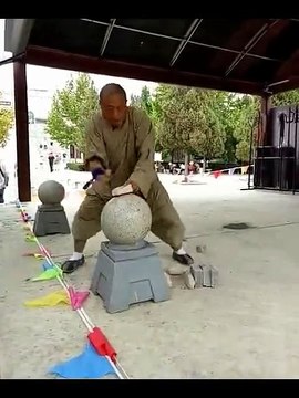 Wow! It must be Shaolin Kung Fu. The man can even break bricks with iron palm and iron fingers!!!