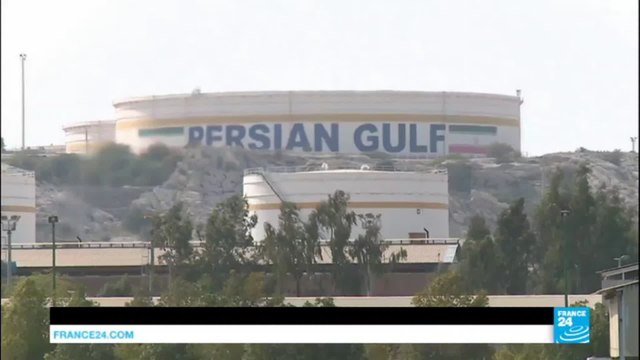 Business: OPEC agrees to cut oil production for the 1st time in 8 years