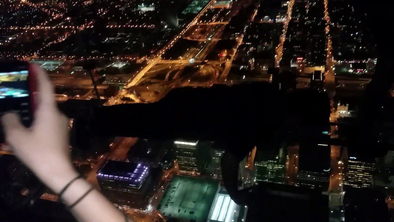 Doing pushups in Ledge Willis Tower Chicago