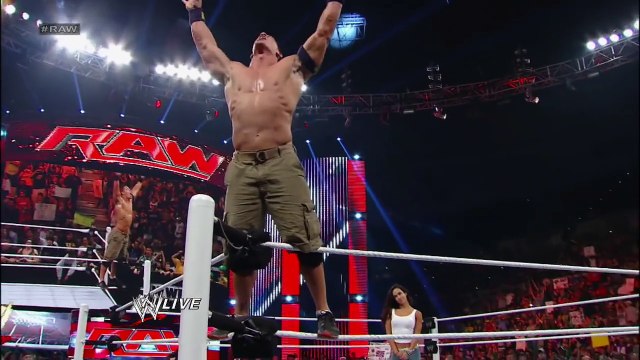 John Cena and AJ Lee kiss after Cena's victory over Dolph Ziggler: Raw, Nov. 26, 2012
