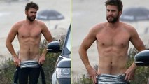 Liam Hemsworth Bares Ripped Abs While Stripping Out of Wetsuit