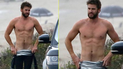 Liam Hemsworth Bares Ripped Abs While Stripping Out of Wetsuit
