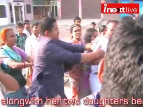 Wife beats husband in full public view