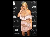 Kanye West model Amina Blue struggles to maintain modesty in VERY daring slashed dress