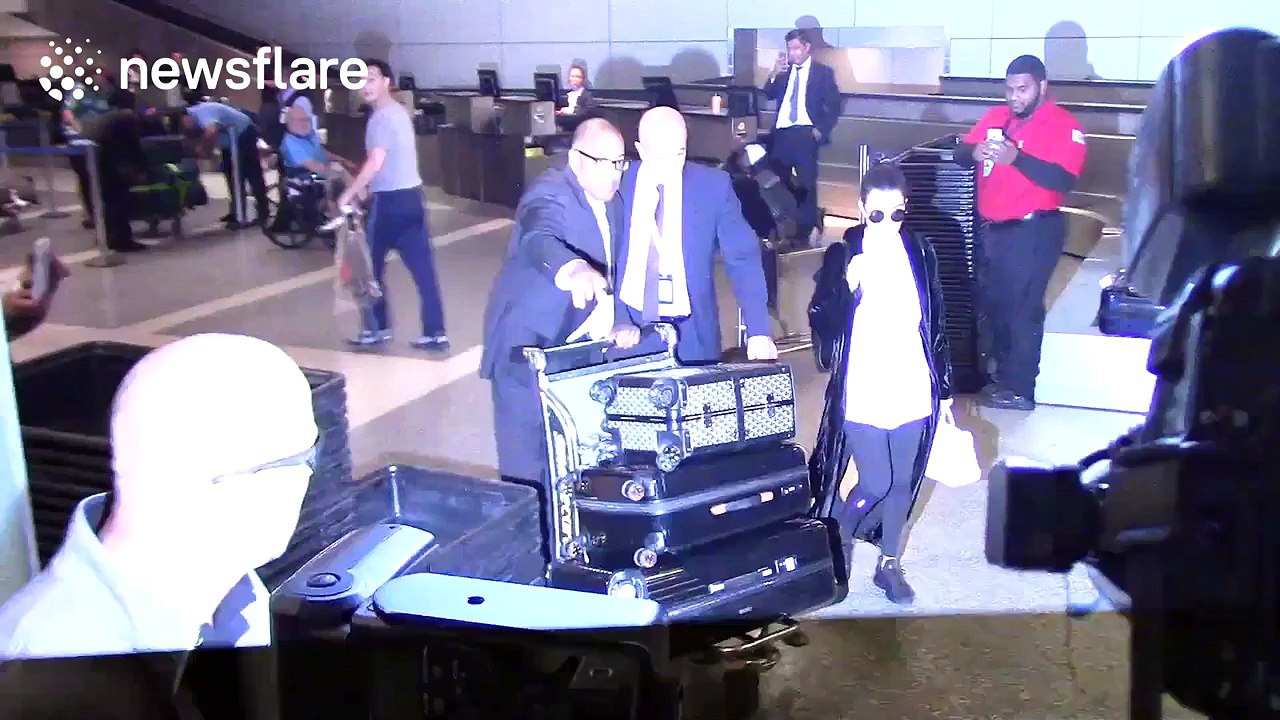 Kourtney Kardashian gets mobbed by paparazzi after sister Kim was attacked in Paris