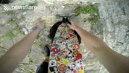 Daredevil rides long-board on top of ancient convent in risky stunt