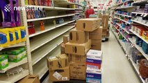 Florida supermarket staff re-stocking after Hurricane Matthew panic buying