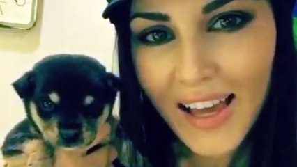 Awww! Sunny Leone playing with cute little Pet Dog