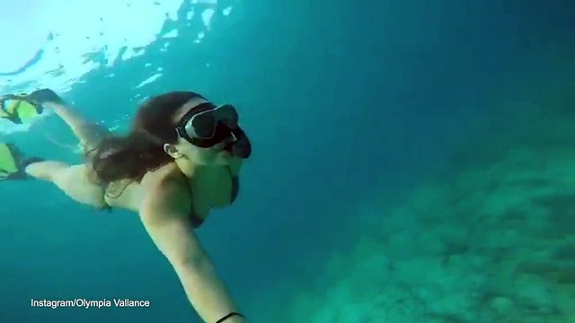 Olympia Vallance swims underwater in her bikini with a GoPro