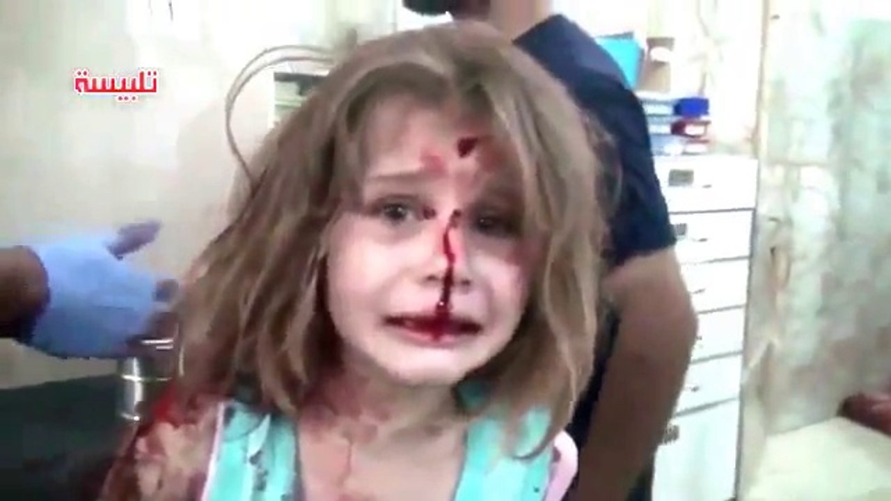 Syrian girl cries for her father after she becomes latest victim of the civil war